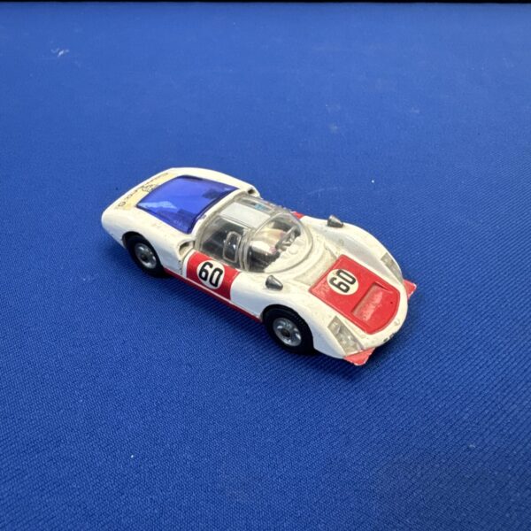 Vintage Corgi Porsche Carrera 6 diecast toy car, side view.