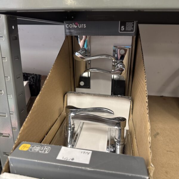 Pair of new Colours Sennen chrome door handles in packaging.