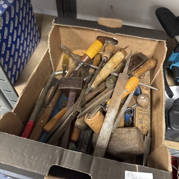 Tray of vintage hand tools for workshop and DIY projects.