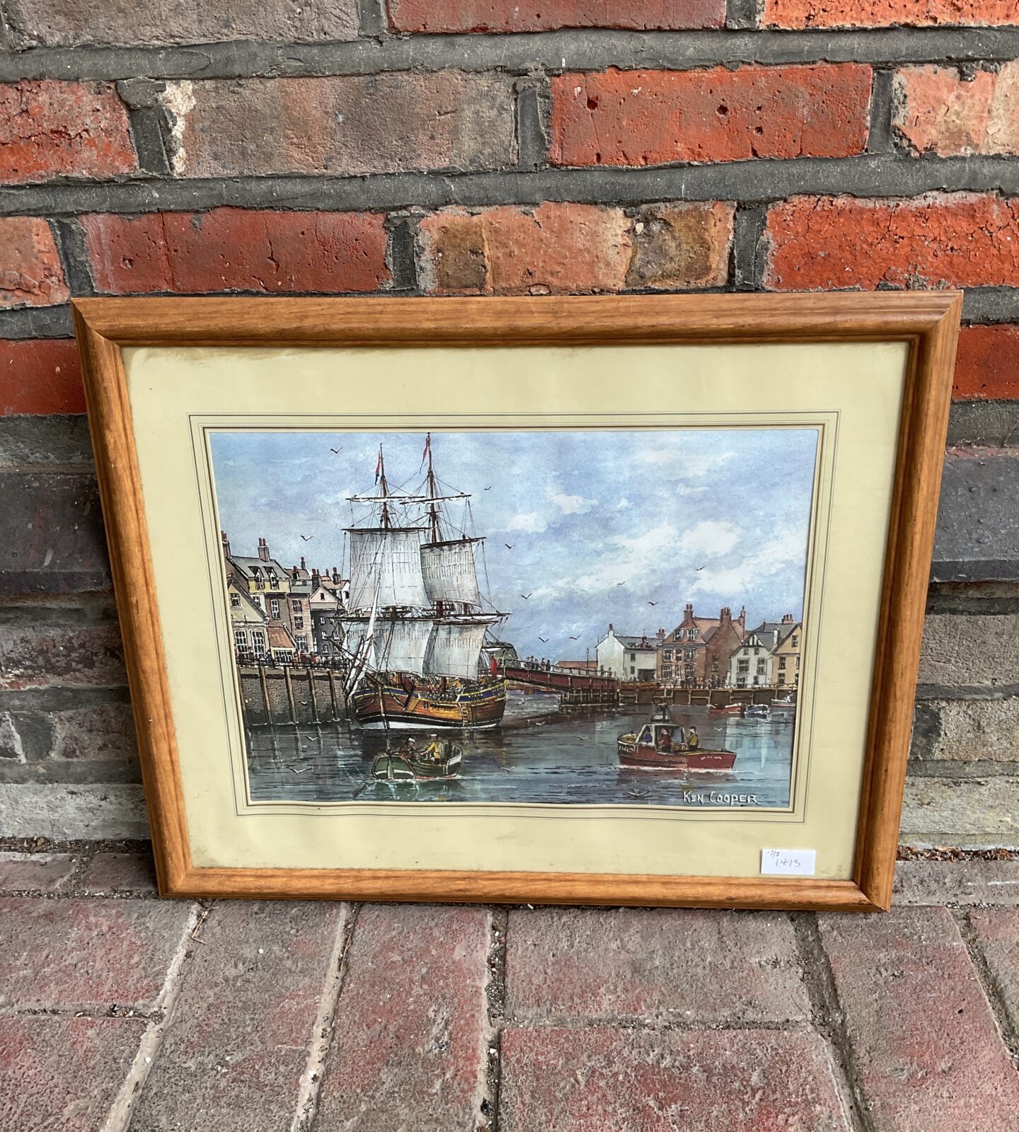 Ken cooper framed print of a harbour scene with large sail boat