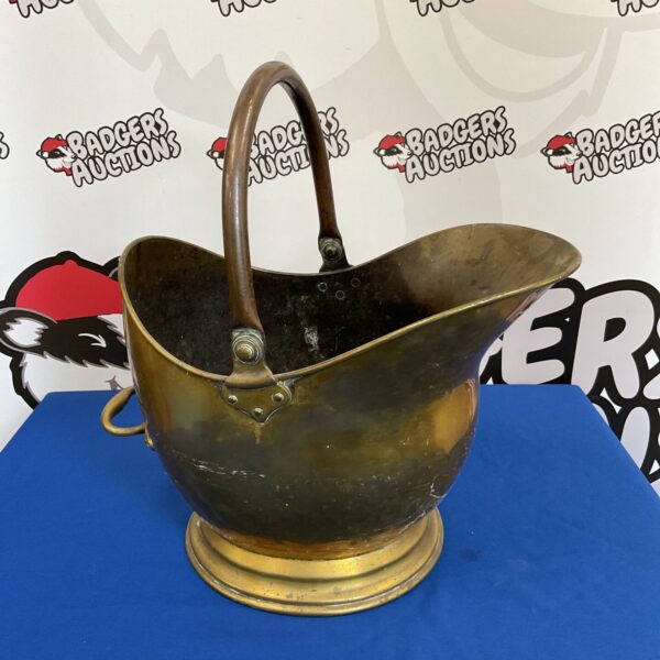 Antique brass helmet coal scuttle for fireplace use.
