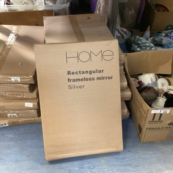 Lot of eight new silver frameless mirrors in original packaging.