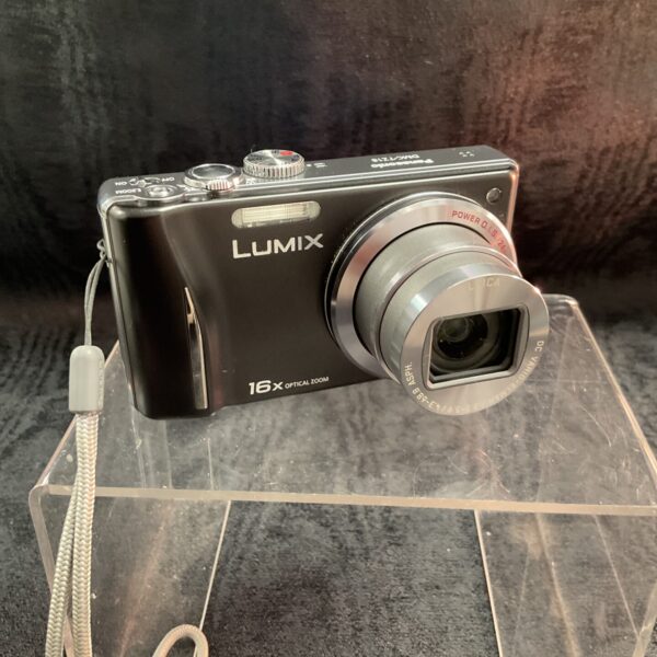 Black Panasonic Lumix DMC-TZ18 digital camera with zoom lens.