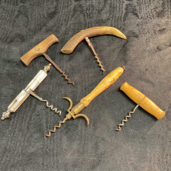 Antique vintage court screw with pearl and horn handles.