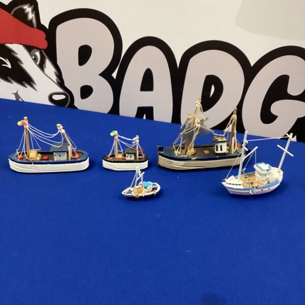 Group of five miniature wooden sailing boats for collectors.