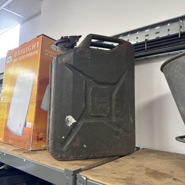 Vintage metal jerry can, showing signs of age and wear.