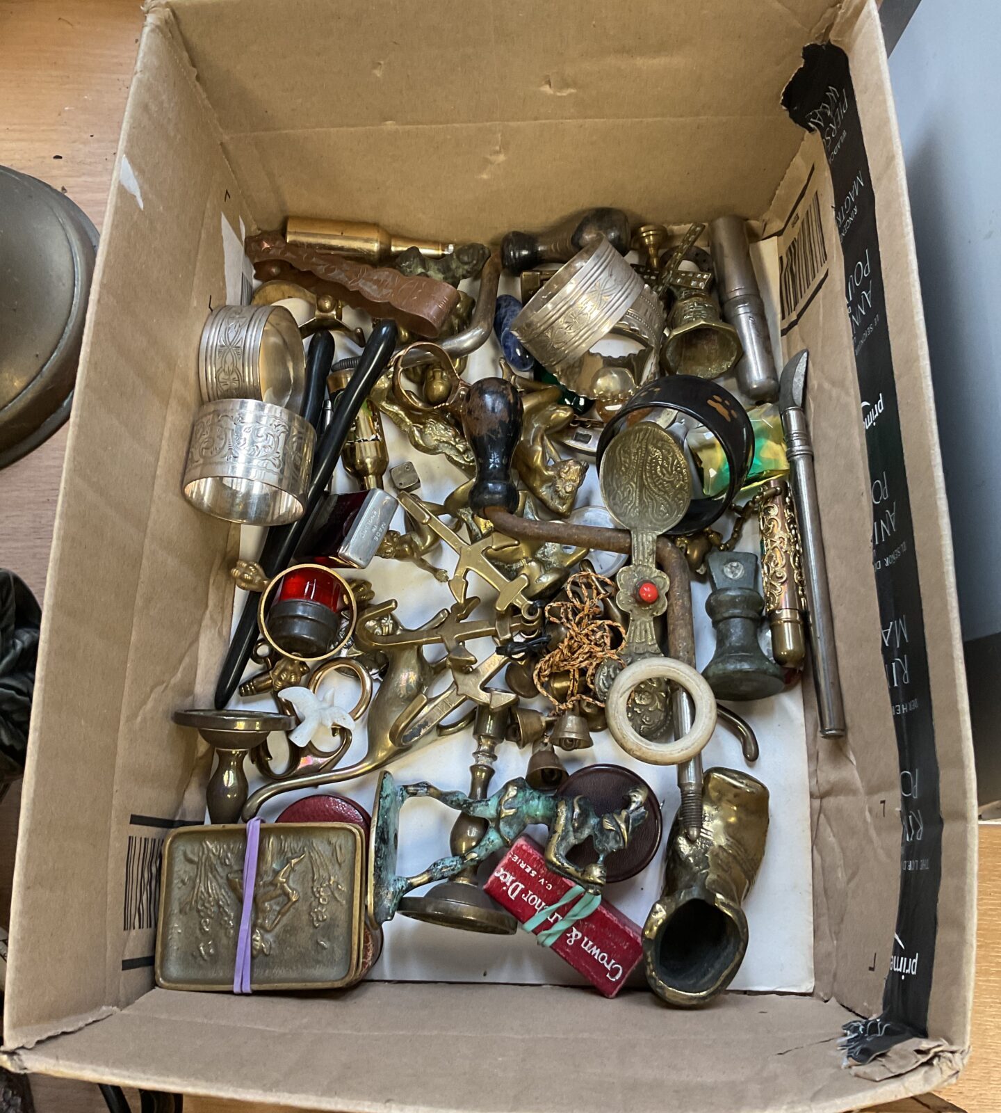 Tray of curios including brass cats, bottle openers & candlesticks