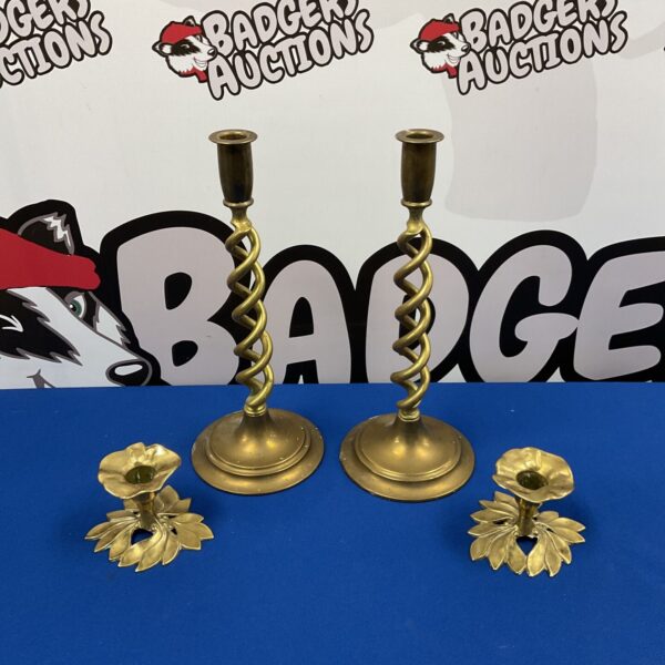 Vintage brass candlesticks with Art Nouveau design details.