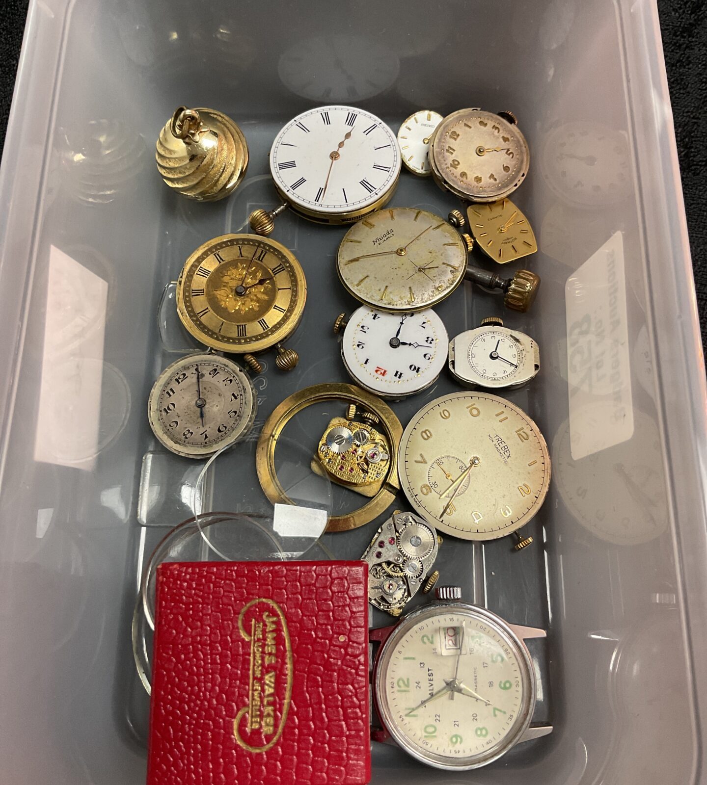 Tray of wristwatch movements and parts