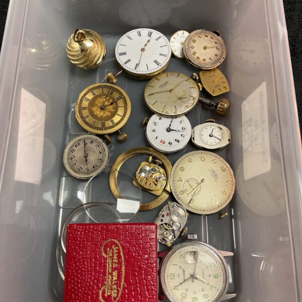 Tray of wristwatch movements and parts