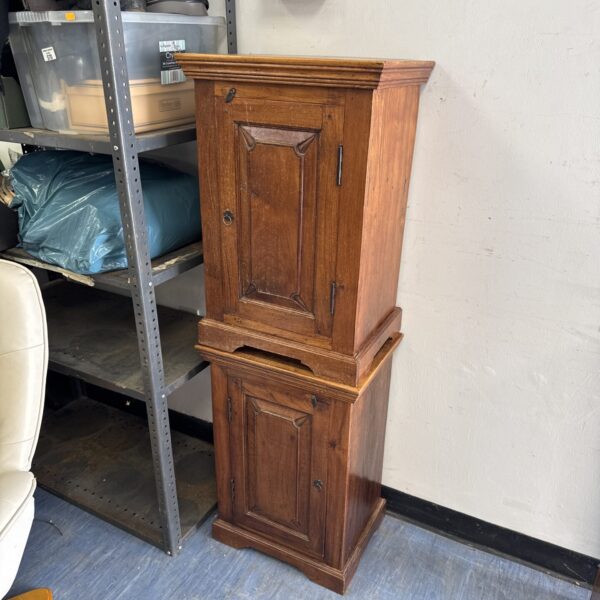 Pair of antique Arts and Crafts oak cabinets in a garage setting.