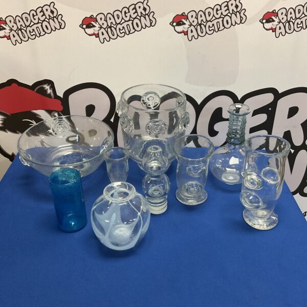 Collection of colourful hand blown art glass pieces on display.