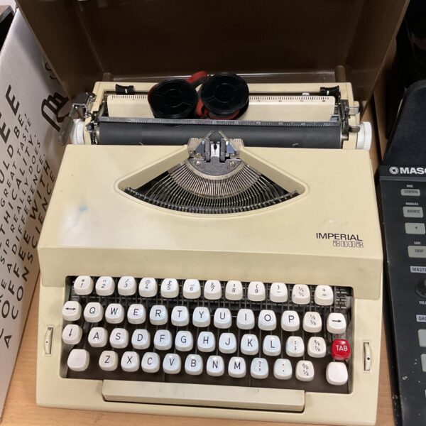 Vintage Imperial 2002 mechanical typewriter in beige.