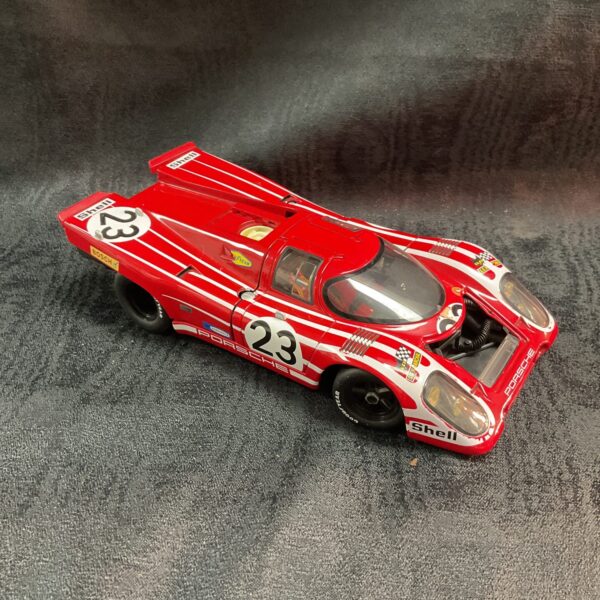 Red Porsche 917K diecast model car with Shell sponsorship.