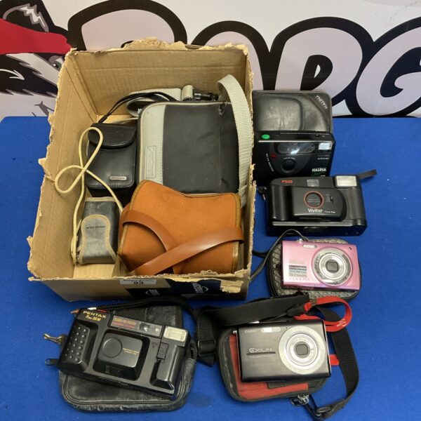 Vintage camera lot with Nikon Coolpix and film cameras in a case.