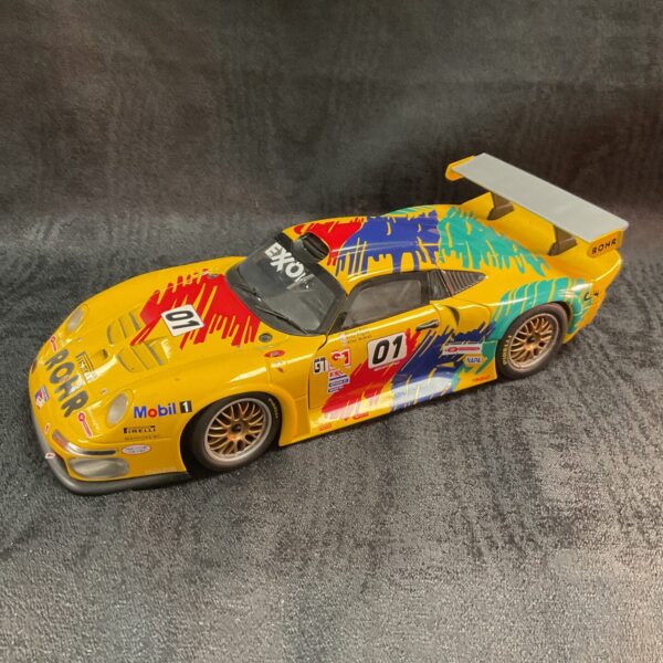 Yellow 1/18 scale Porsche 911 GT1 race car model.