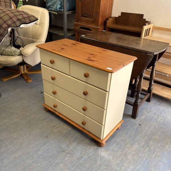 Modern pine chest of drawers with two over three drawers.