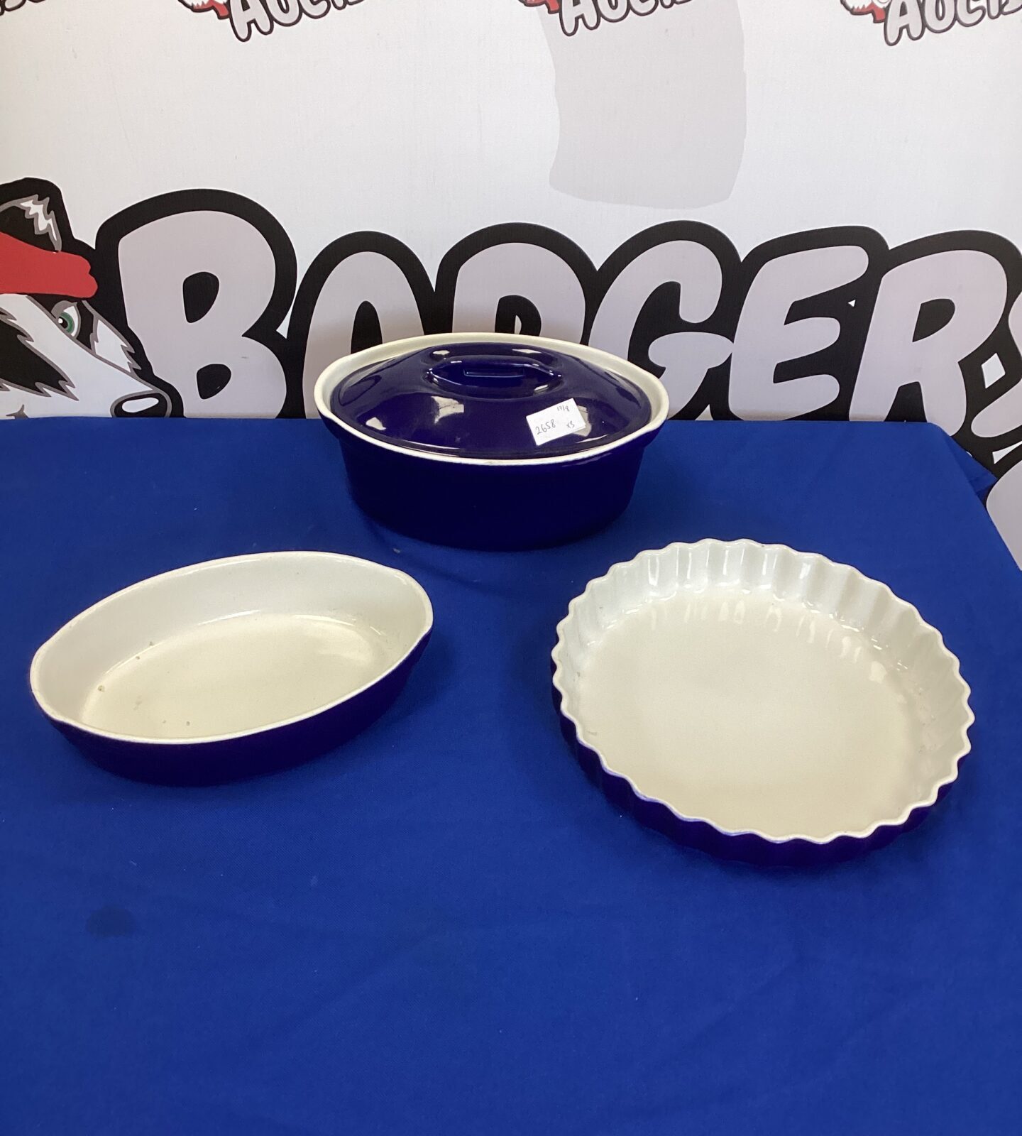 Set of blue casserole and flan dishes