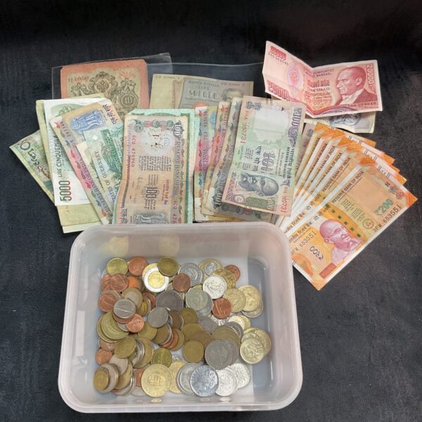 Assorted Indian banknotes and coins in a mixed denomination lot.