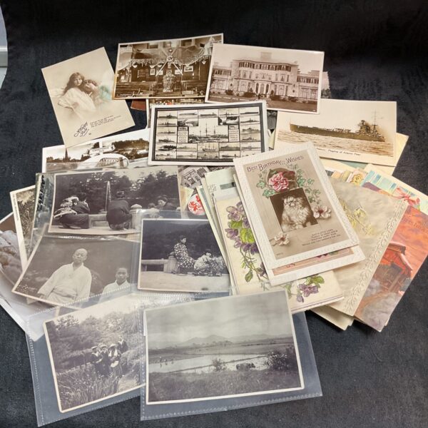 Lot of vintage postcards with diverse scenes and greetings.