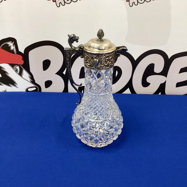 Antique Victorian claret jug with silverplate and cut glass.