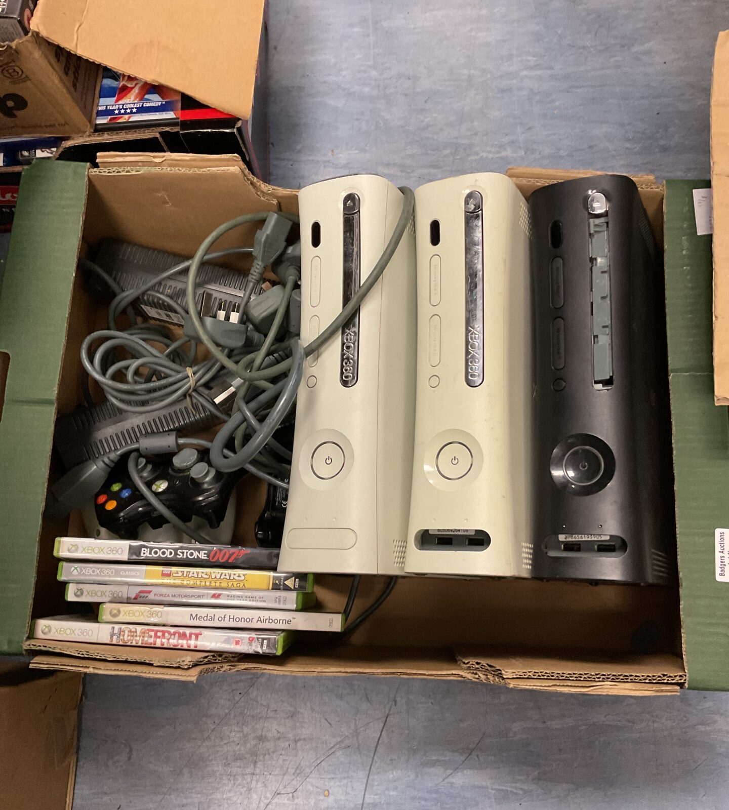 Tray of mucrosoft xbox 360 consoles  & games
