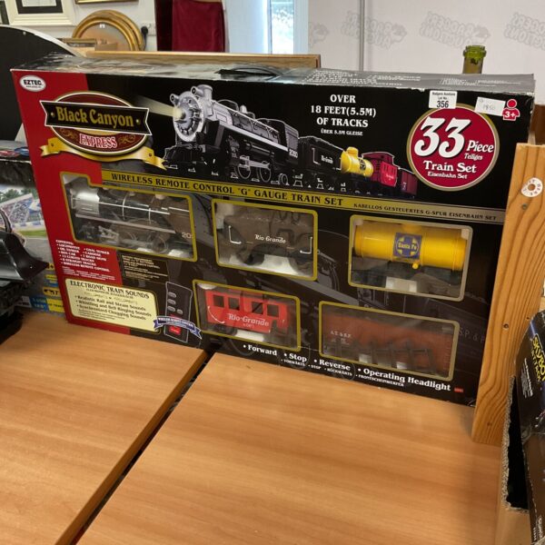Vintage Eztec Black Canyon Express 33-piece train set with track pieces.