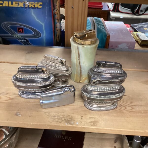 Selection of vintage lighters in a collectible lot.