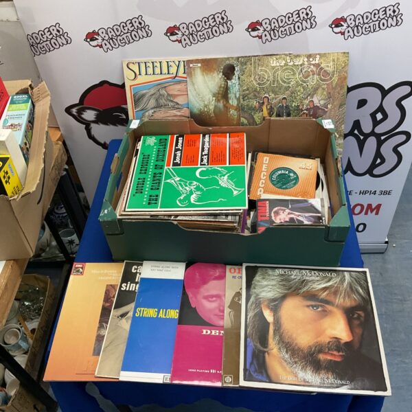 Mixed lot of vintage vinyl records, including 12” and 7” formats.