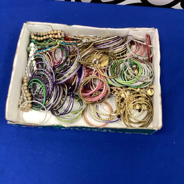 Tray of colourful mixed bangles, vintage fashion jewellery.