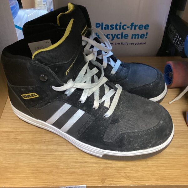 Size 10 Stanley safety boots showing wear and tear.