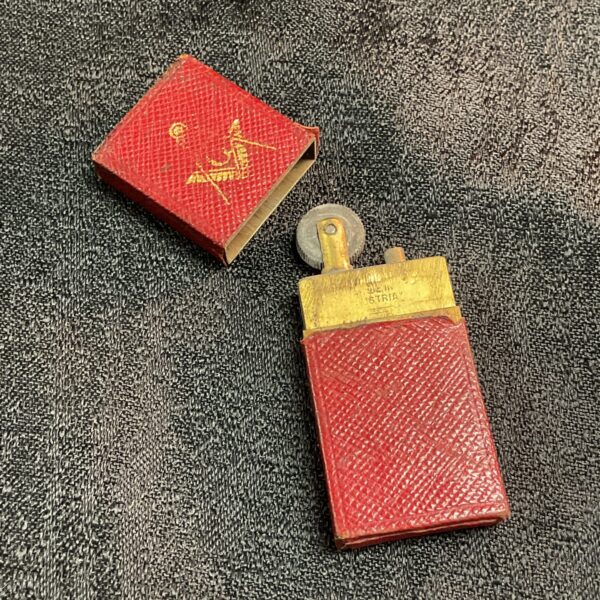 Vintage WW1 Austrian Masonic lighter with red cover.
