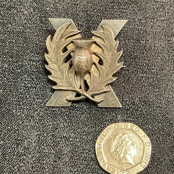 Vintage Scottish Thistle badge from 1920 with Chinese characters.