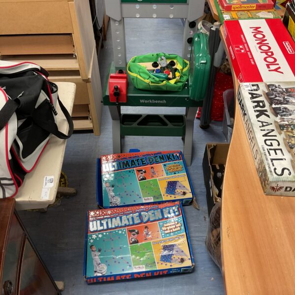 Childrens plastic Bosch workbench with building model kits on display.