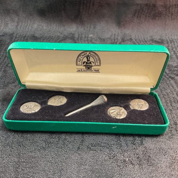 Vintage pewter golf tee and ball marker set for collectors.