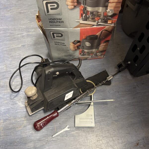 Performance Pro 1020W router, electric planer, and screwdriver set for DIY projects.