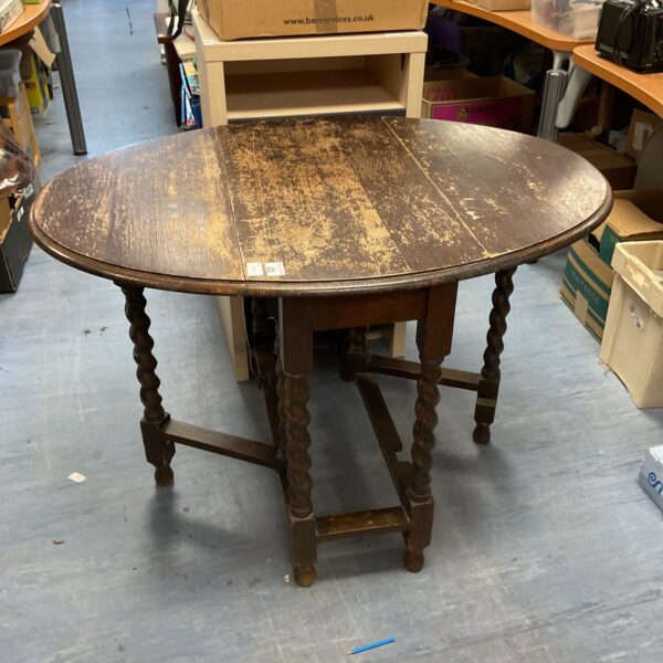 Vintage oak gateleg table with barley twist legs.