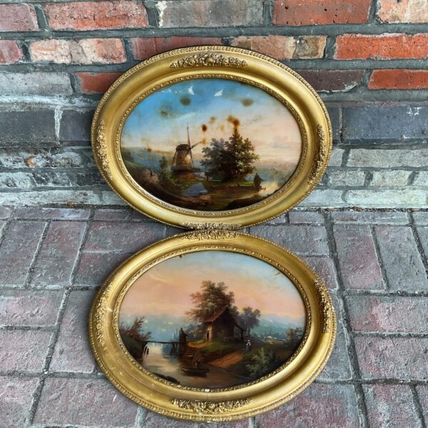 Antique oil painting of a village scene with a windmill and gilt frame.