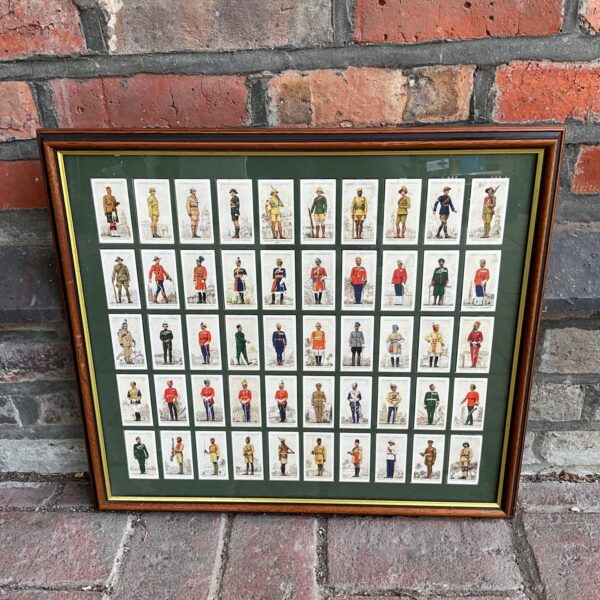 Framed set of vintage players military uniforms cigarette cards