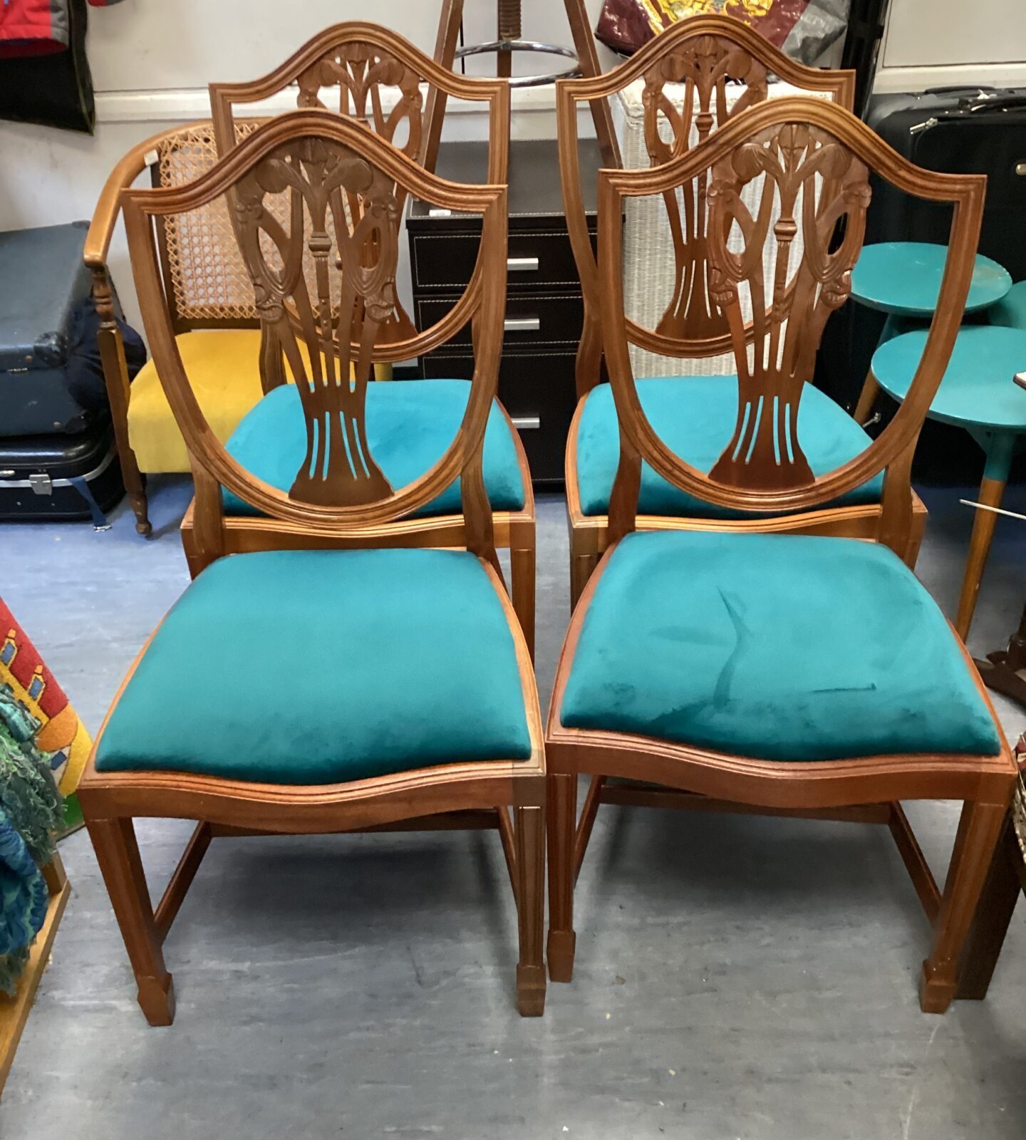 Four shield back hepplewhite dining chairs