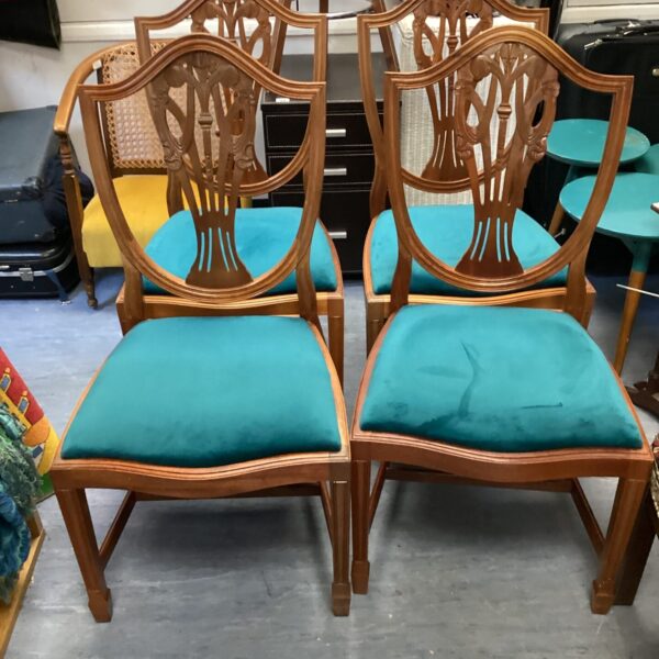 Four shield back hepplewhite dining chairs