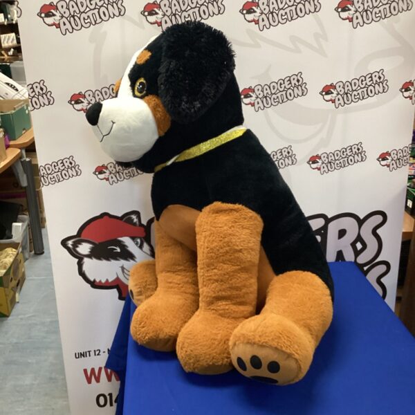 Large black and tan dog cuddly toy for comfort.