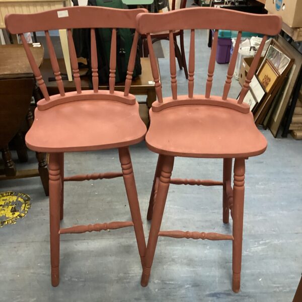 Vintage painted bar stools with spindle backs and turned legs.