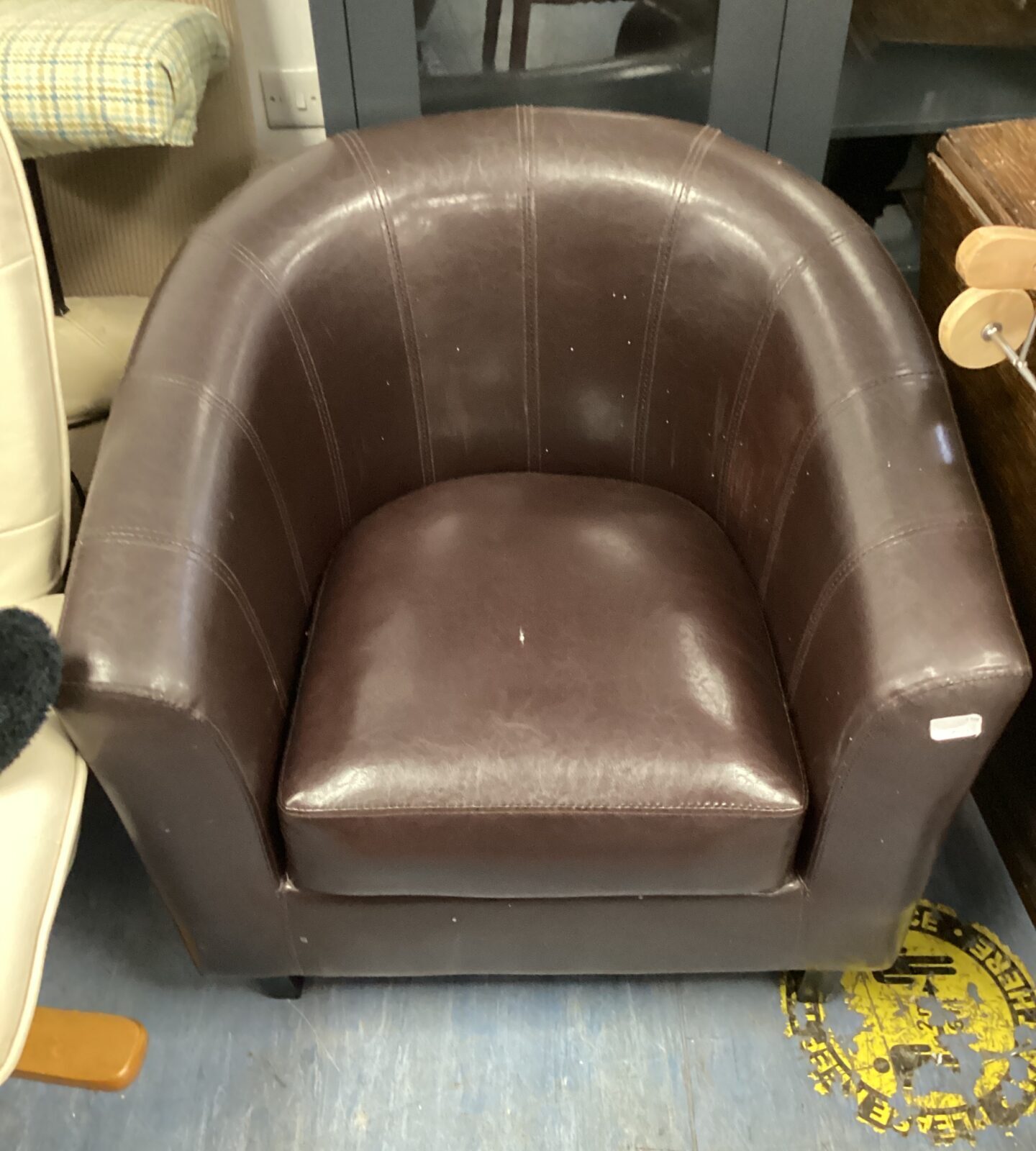 Brown leather tub chair