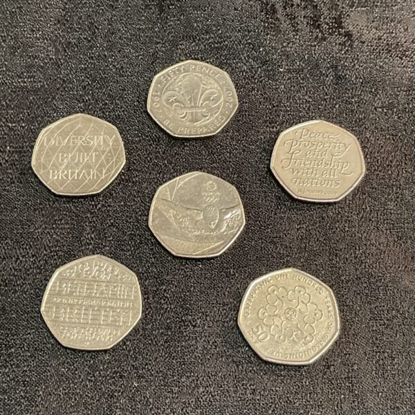 UK 50p coin collection featuring Olympic and Scout designs.