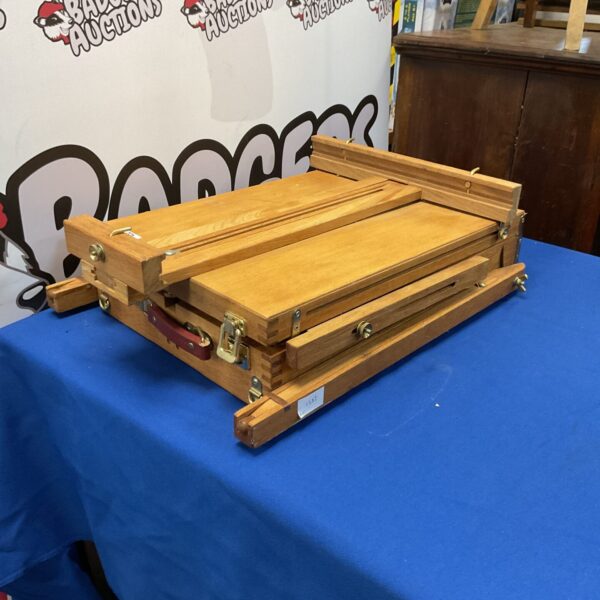 Vintage wooden sketch box easel with storage compartment.