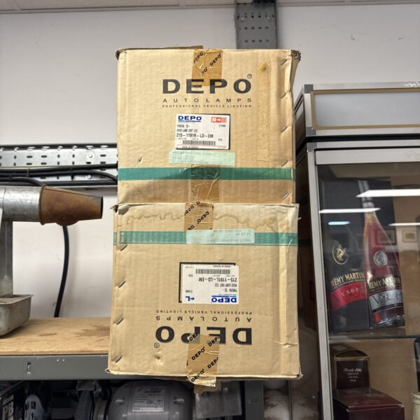 Depo Nissan Primera headlights in original packaging.