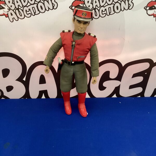 Vintage Captain Scarlet doll in red uniform, a classic sci-fi collectible.