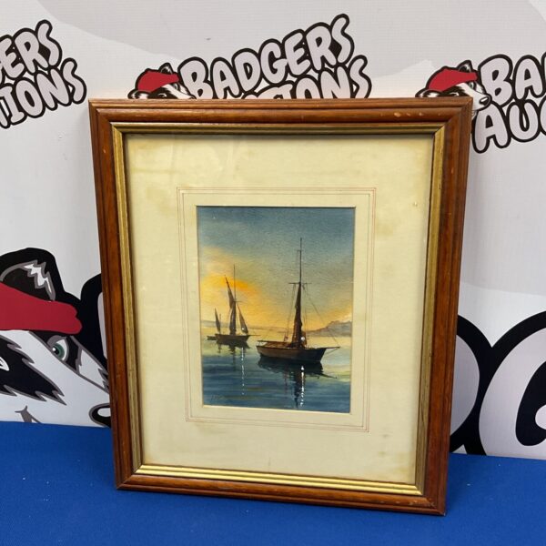 Signed watercolour painting of sailboats at dusk.