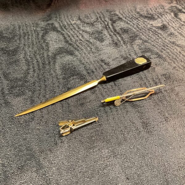 Vintage Stratton tie clips and letter opener set in gold plating.